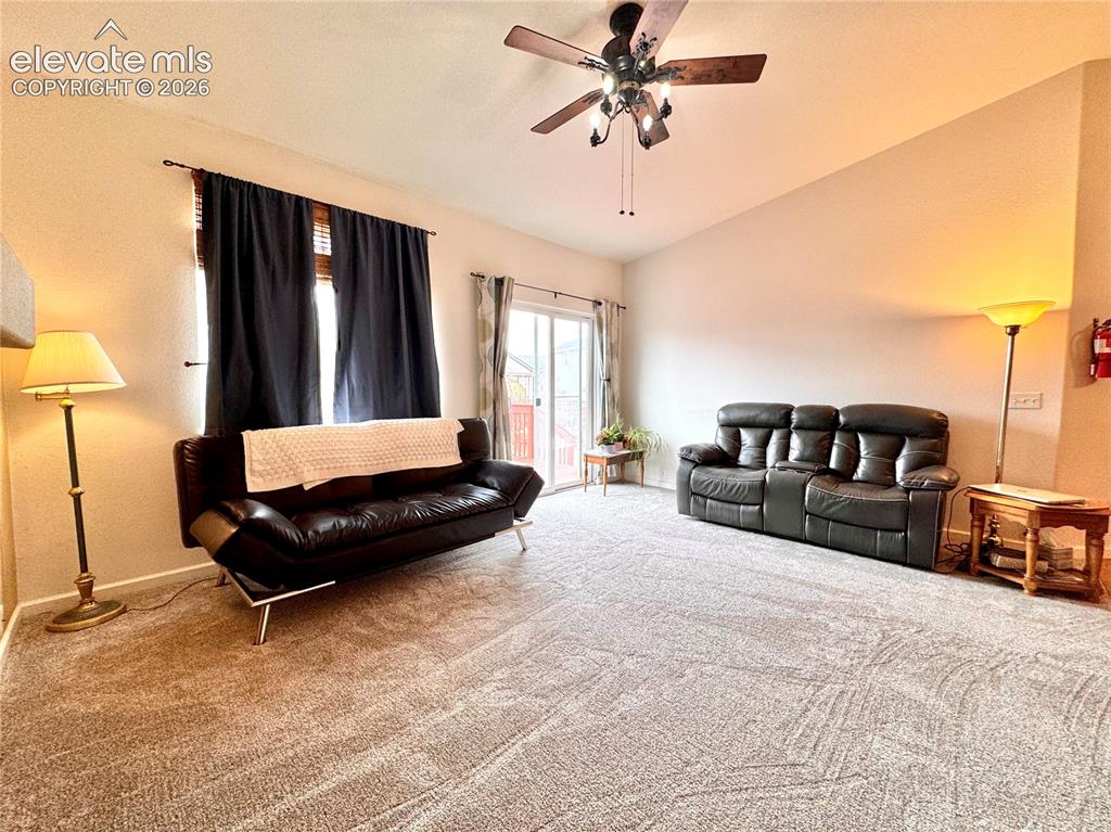 9362 St.George Road Peyton, CO 80831 - Photo 8 of 32 a bedroom with a bed a couch and dresser