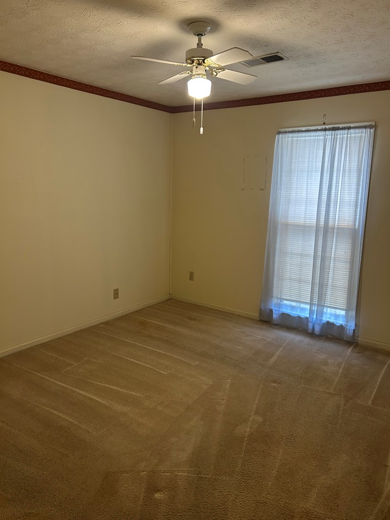4032 Pickering Drive Columbus, GA 31907 - Photo 16 of 35 an empty room with windows and fan