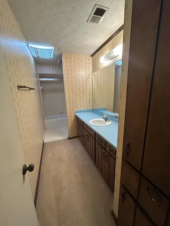 a bathroom with a shower and bathtub
