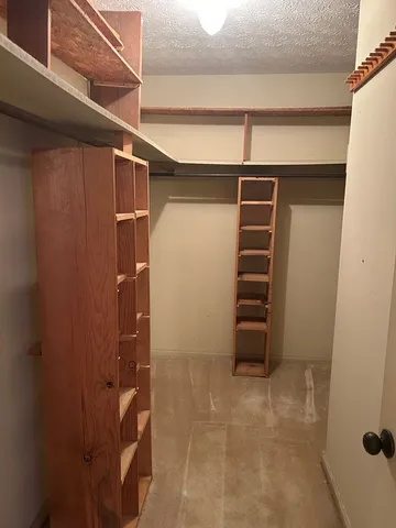 a bathroom with a tub and shower