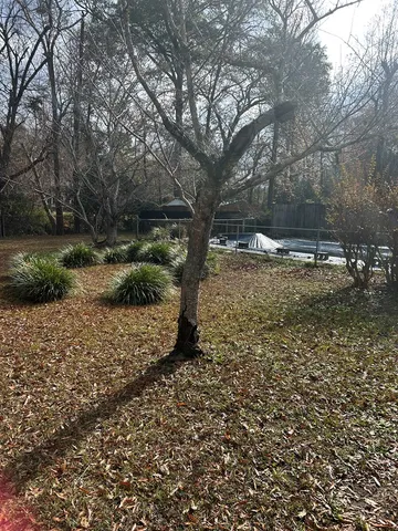 a view of a backyard with sitting area