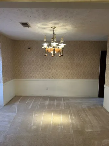 a view of a room with a chandelier