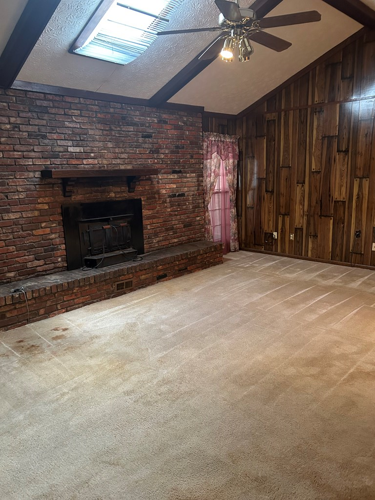 4032 Pickering Drive Columbus, GA 31907 - Photo 6 of 35 an empty room with windows and fireplace