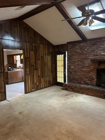 a view of a livingroom with a fireplace and furniture