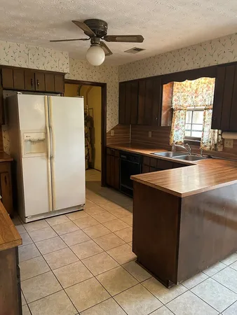 a kitchen with a sink and a window