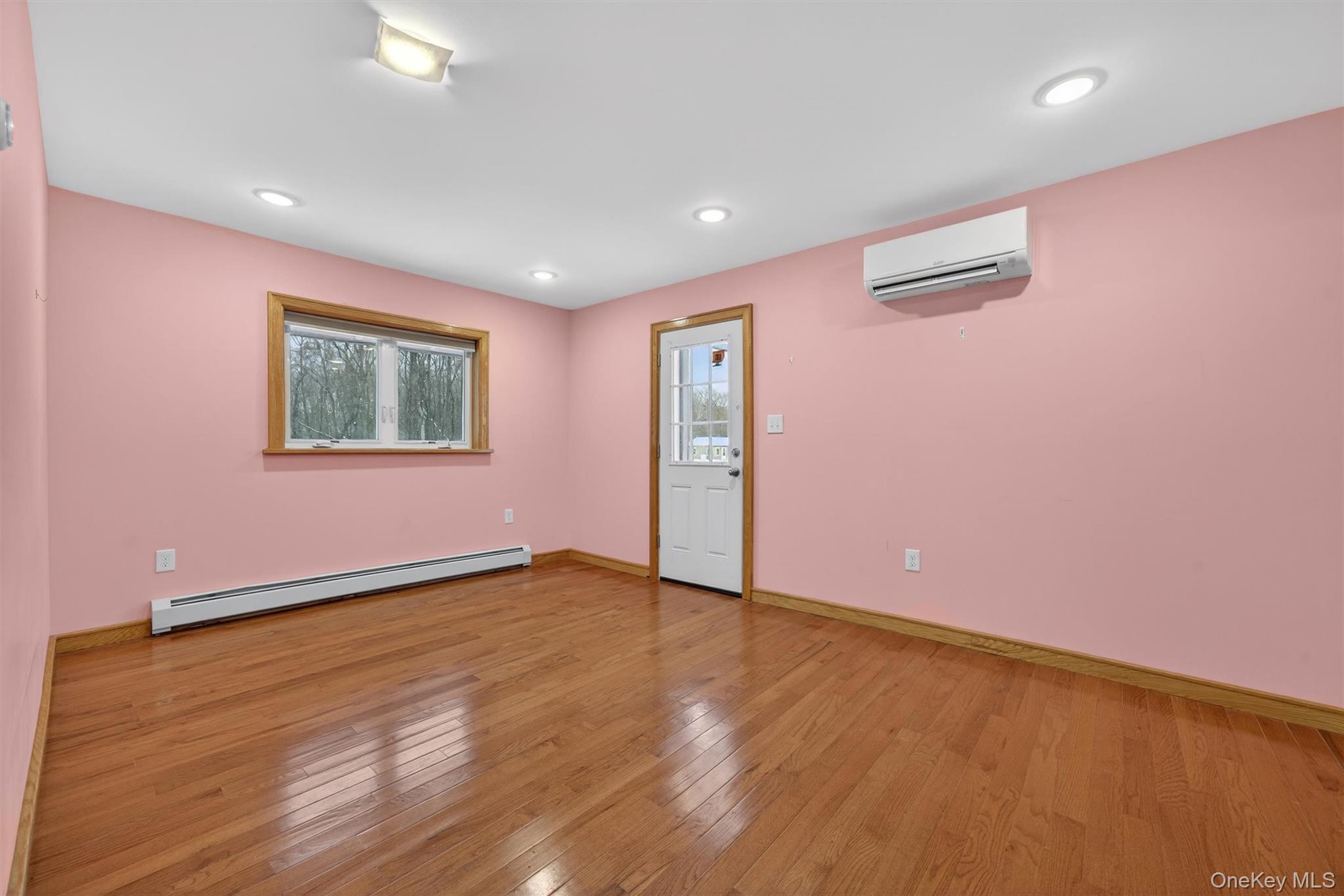 3 Old Country Road Otisville, NY 10963 - Photo 14 of 50 a view of an empty room with wooden floor and a window