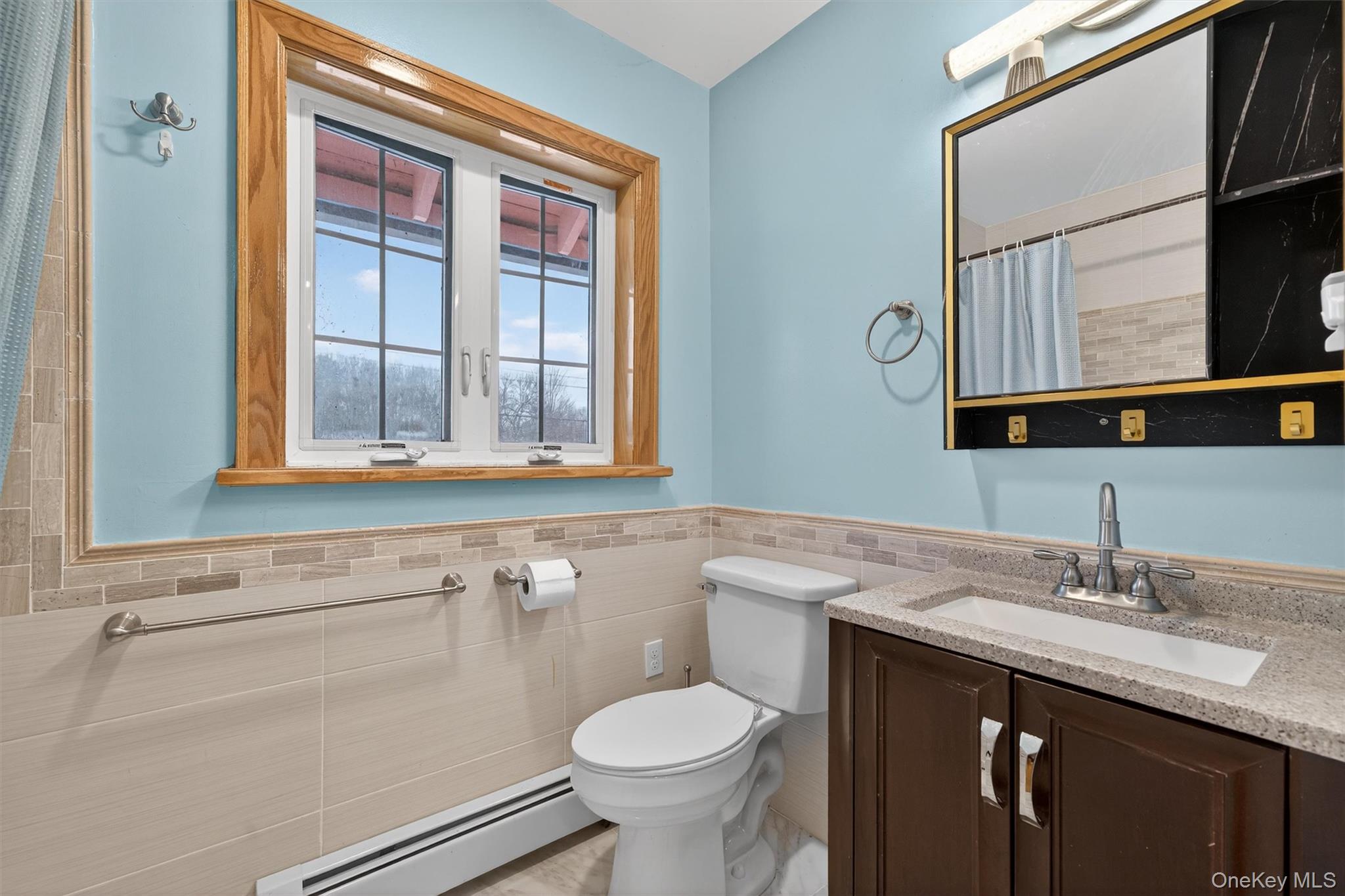 3 Old Country Road Otisville, NY 10963 - Photo 16 of 50 a bathroom with a granite countertop toilet sink and mirror