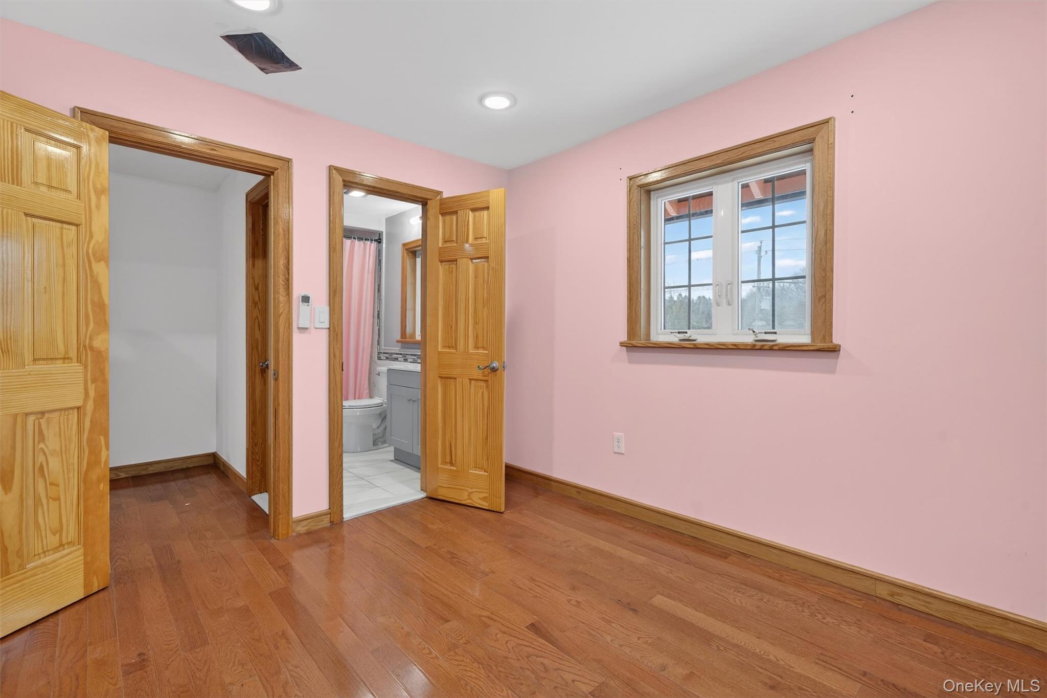 3 Old Country Road Otisville, NY 10963 - Photo 18 of 50 an empty room with wooden floor and windows