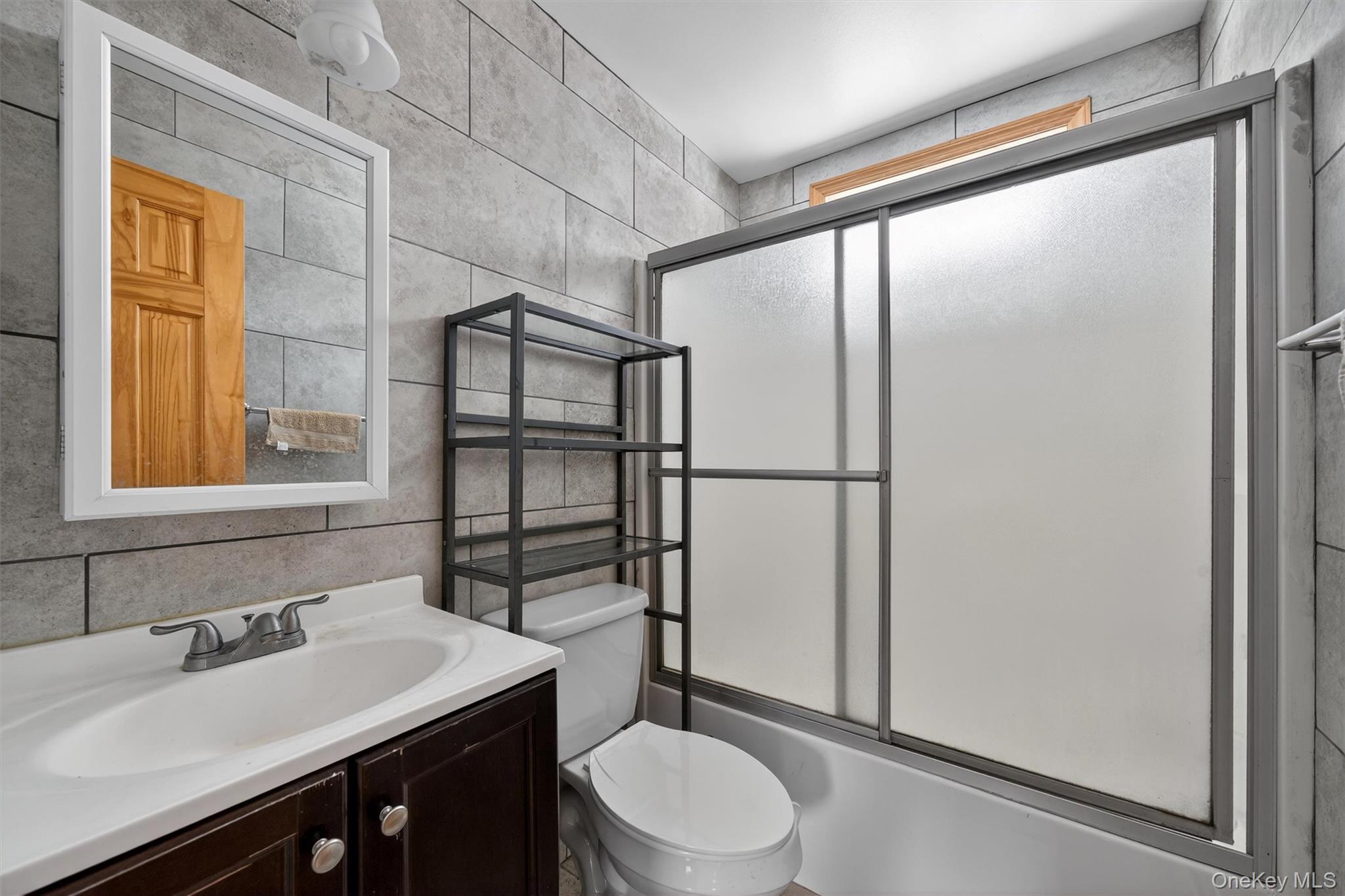 3 Old Country Road Otisville, NY 10963 - Photo 35 of 50 a bathroom with a sink toilet vanity and shower