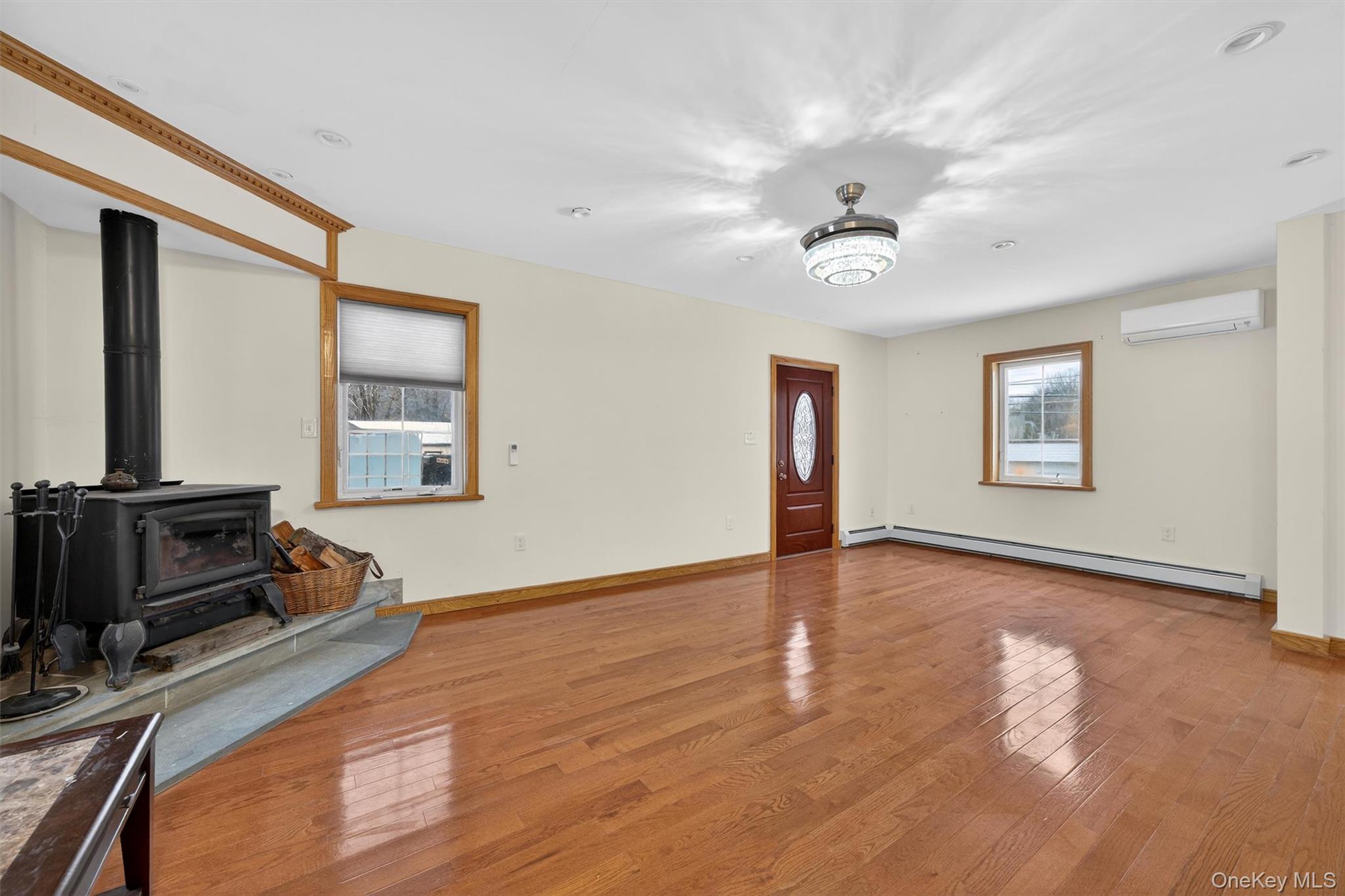 3 Old Country Road Otisville, NY 10963 - Photo 5 of 50 a view of an empty room with window and wooden floor