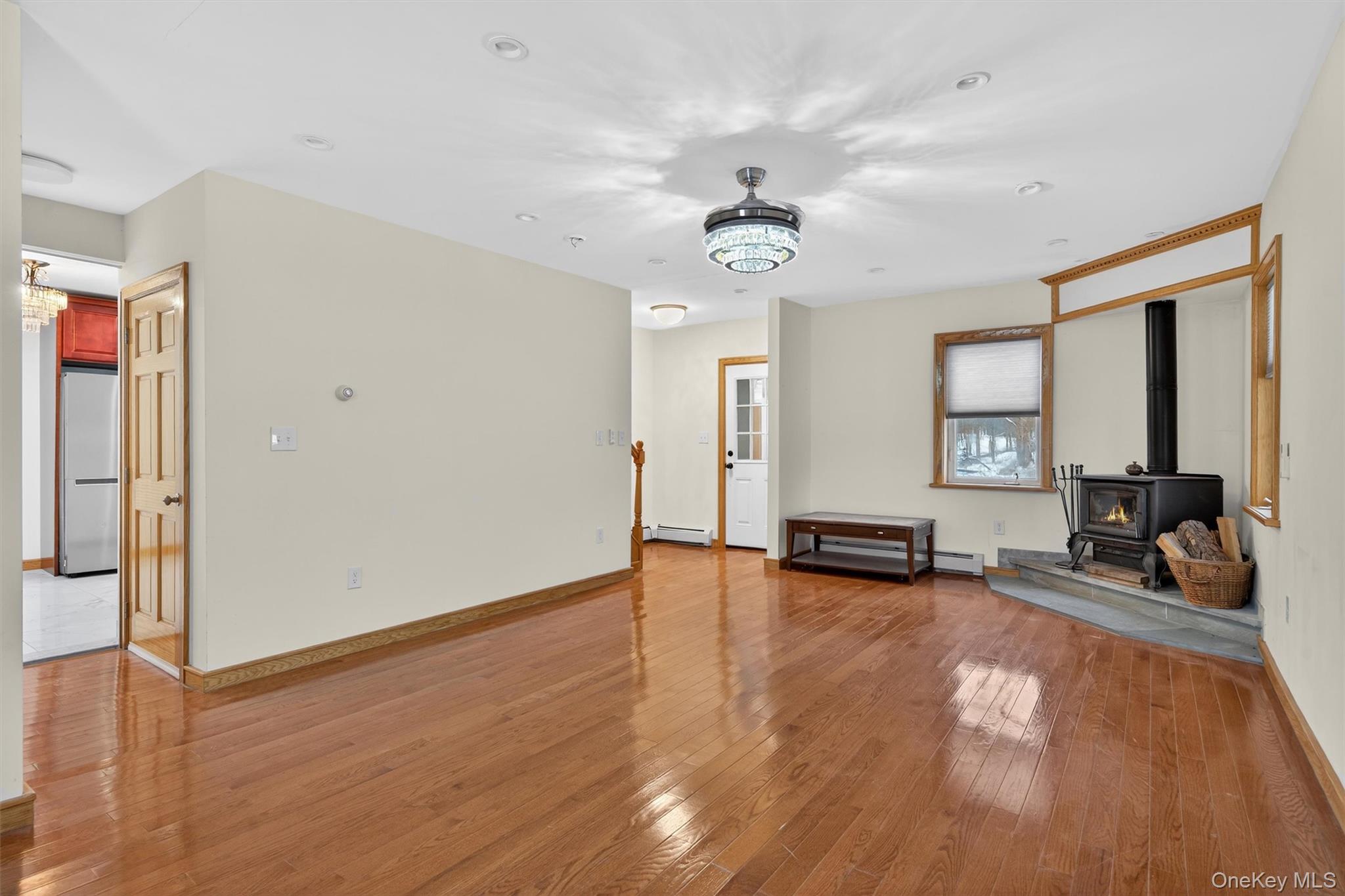 3 Old Country Road Otisville, NY 10963 - Photo 6 of 50 a view of a livingroom with furniture hardwood floor and a ceiling fan