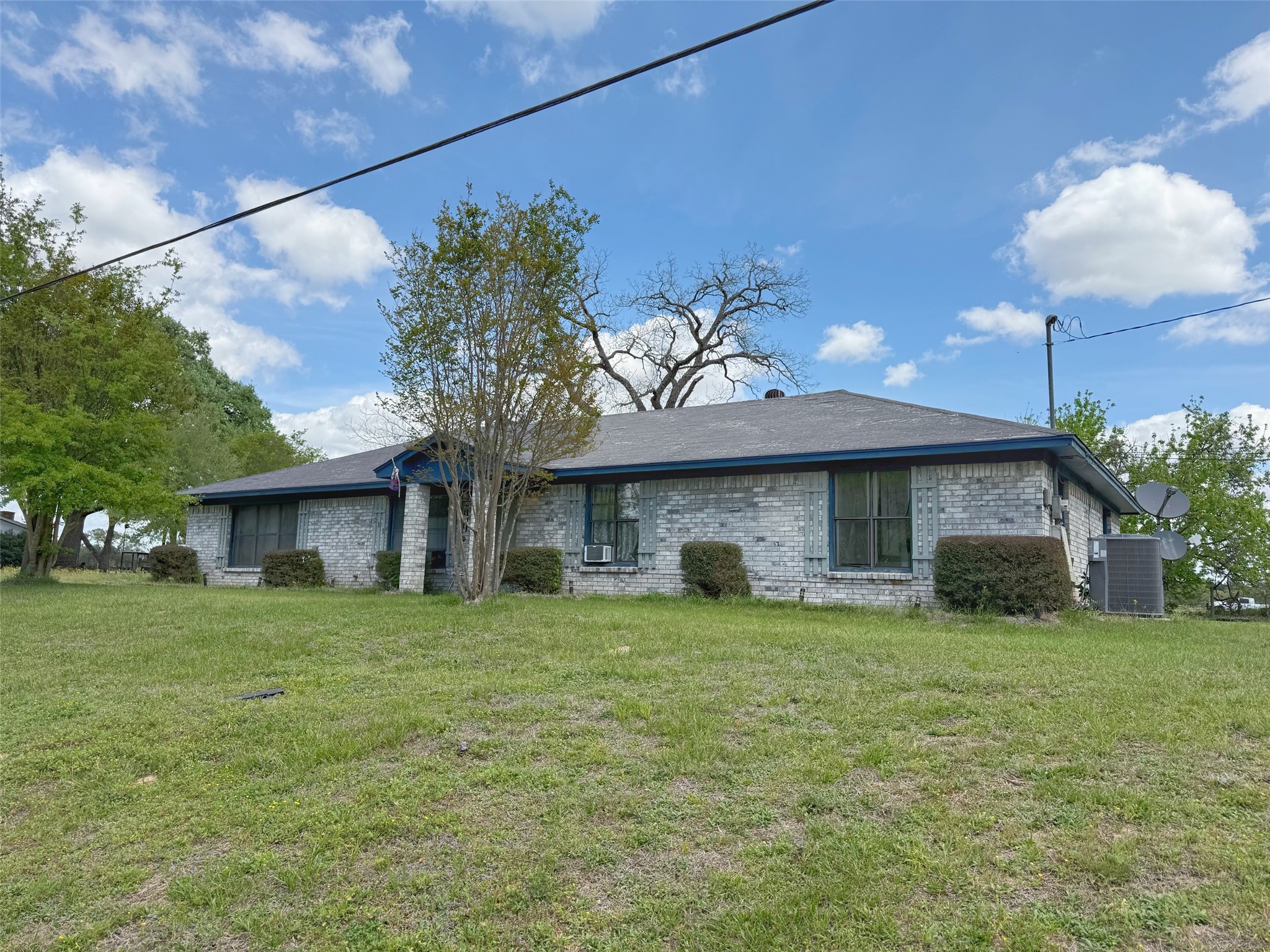 a view of a house with a yard and a garage