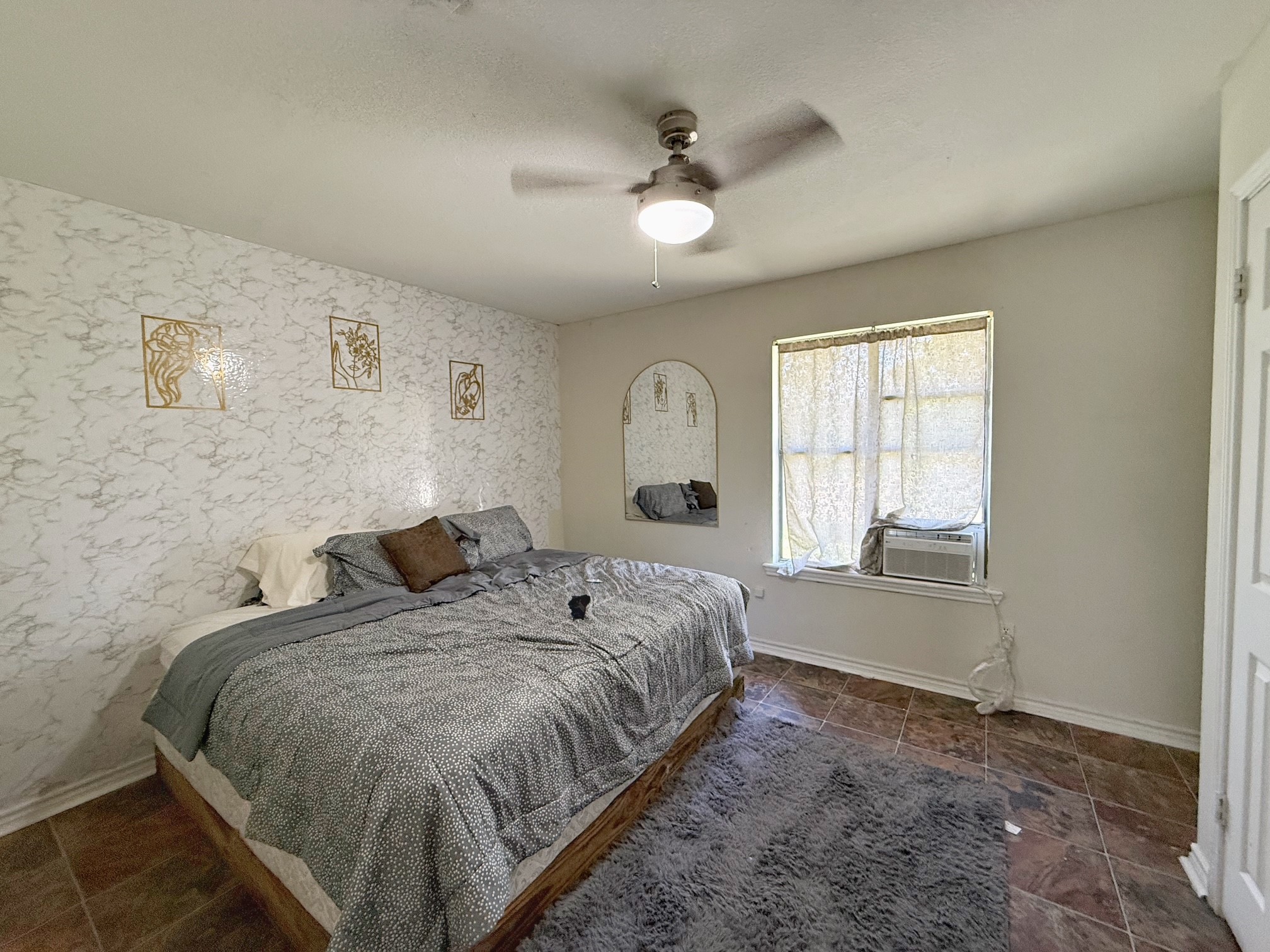 935 Center Street Buffalo, TX 75831 - Photo 12 of 18 a bedroom with a bed and window