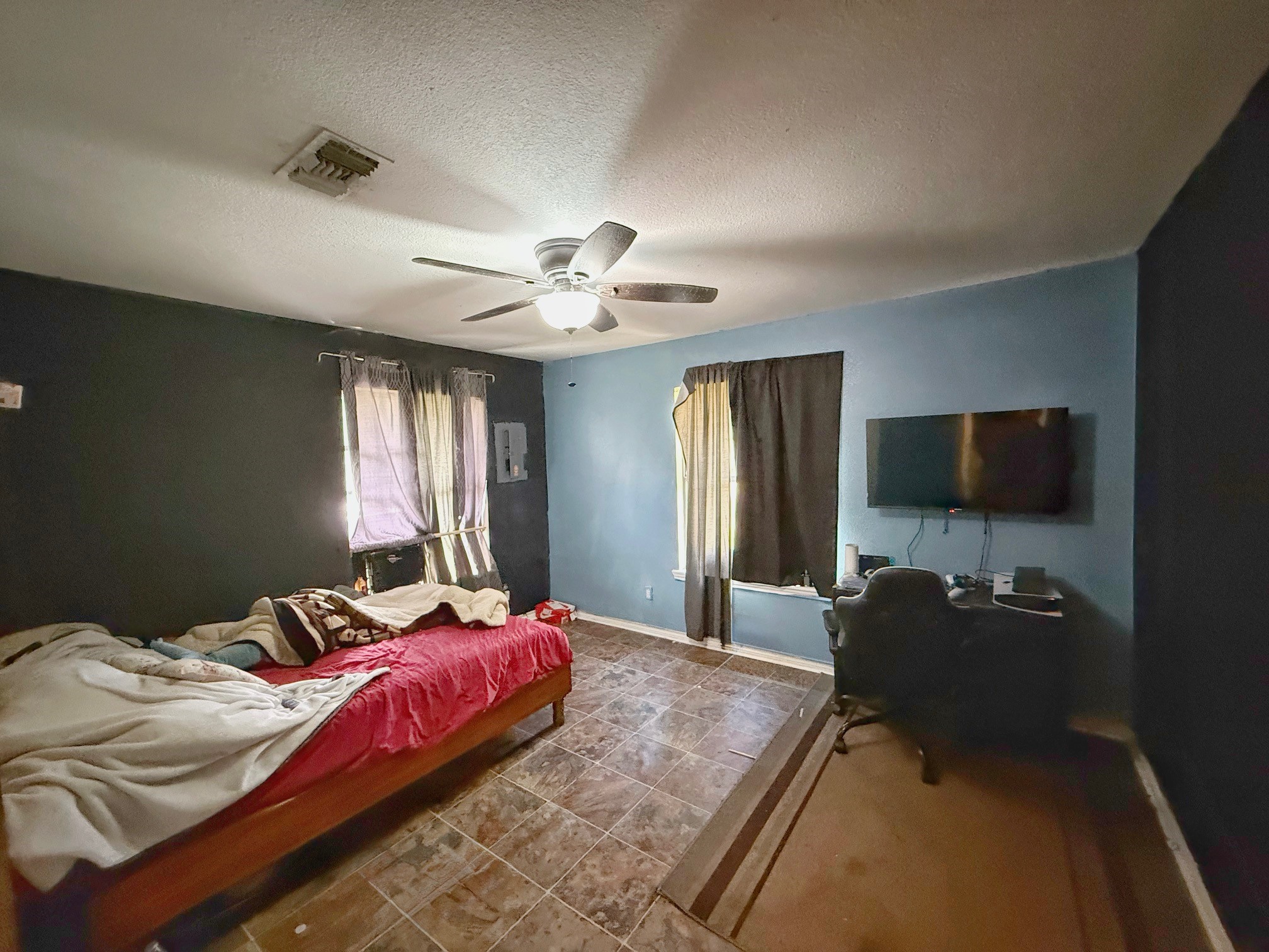 935 Center Street Buffalo, TX 75831 - Photo 13 of 18 a bedroom with a bed and a flat screen tv