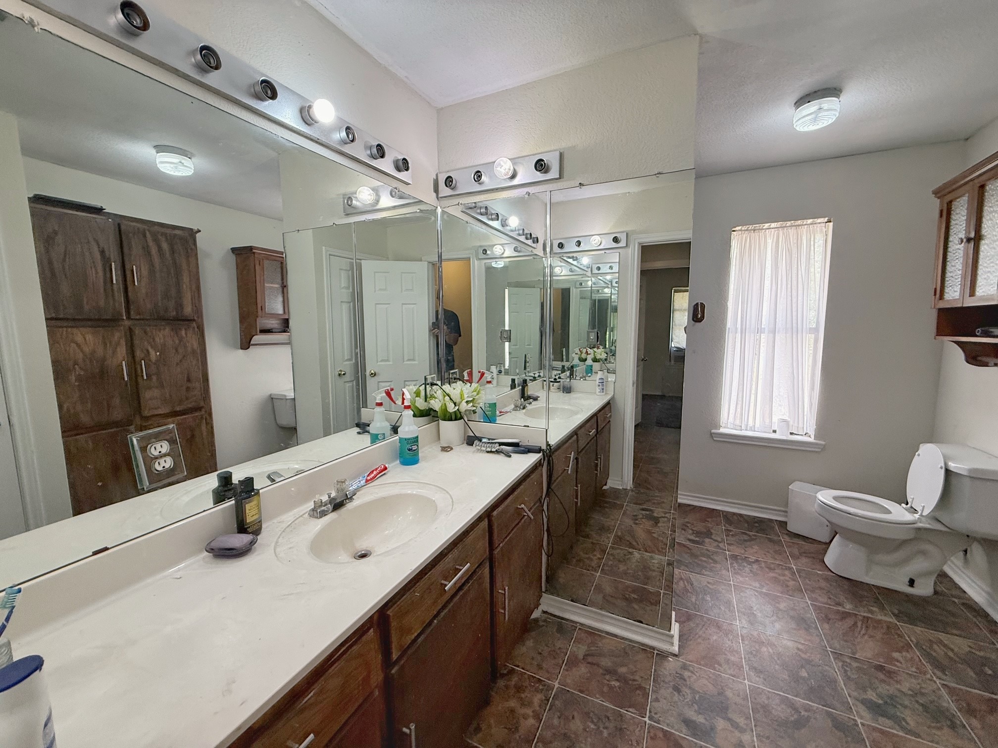 935 Center Street Buffalo, TX 75831 - Photo 14 of 18 a bathroom with a sink double vanity and a mirror