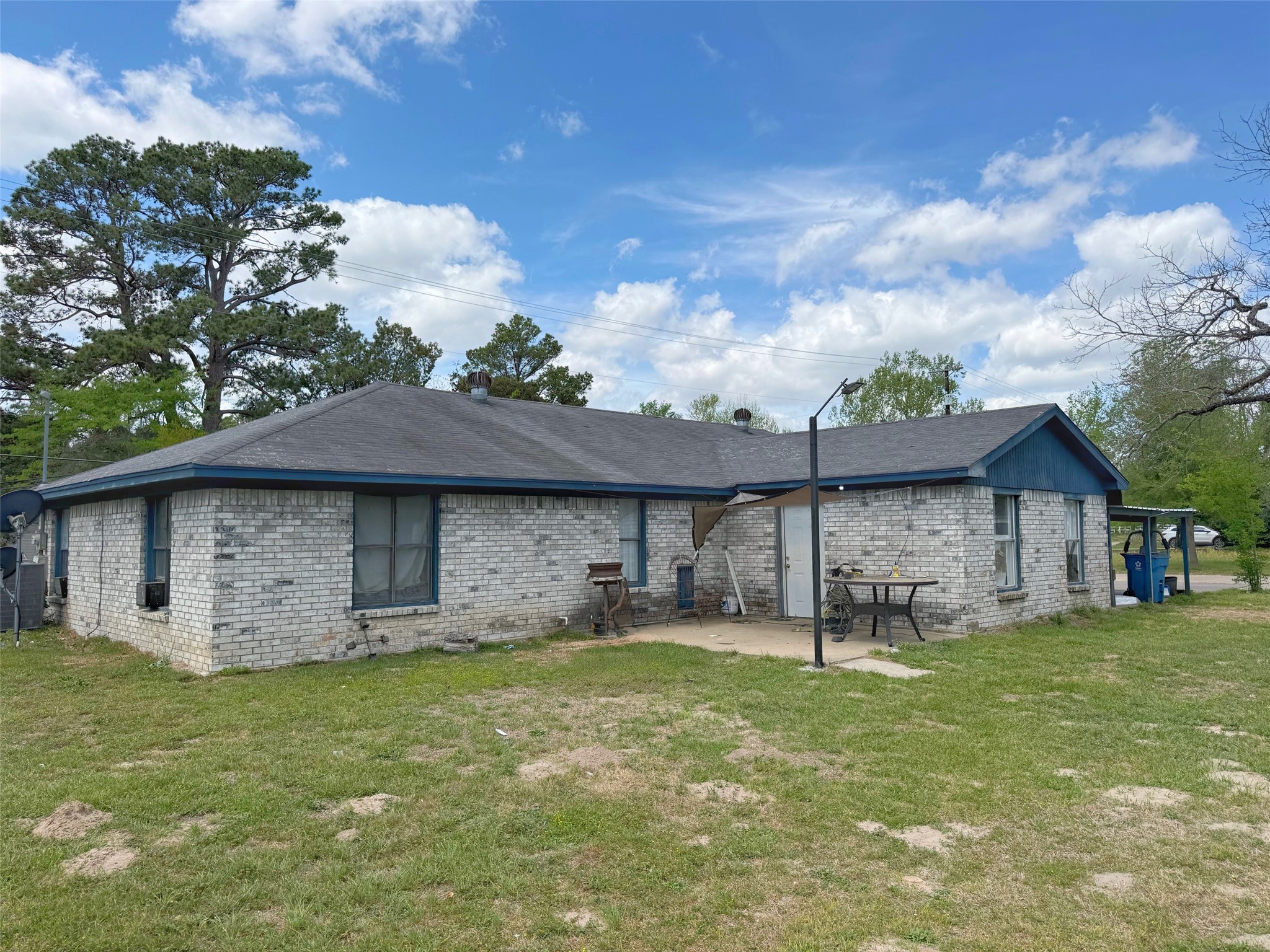 935 Center Street Buffalo, TX 75831 - Photo 4 of 18 a backyard of a house with table and chairs