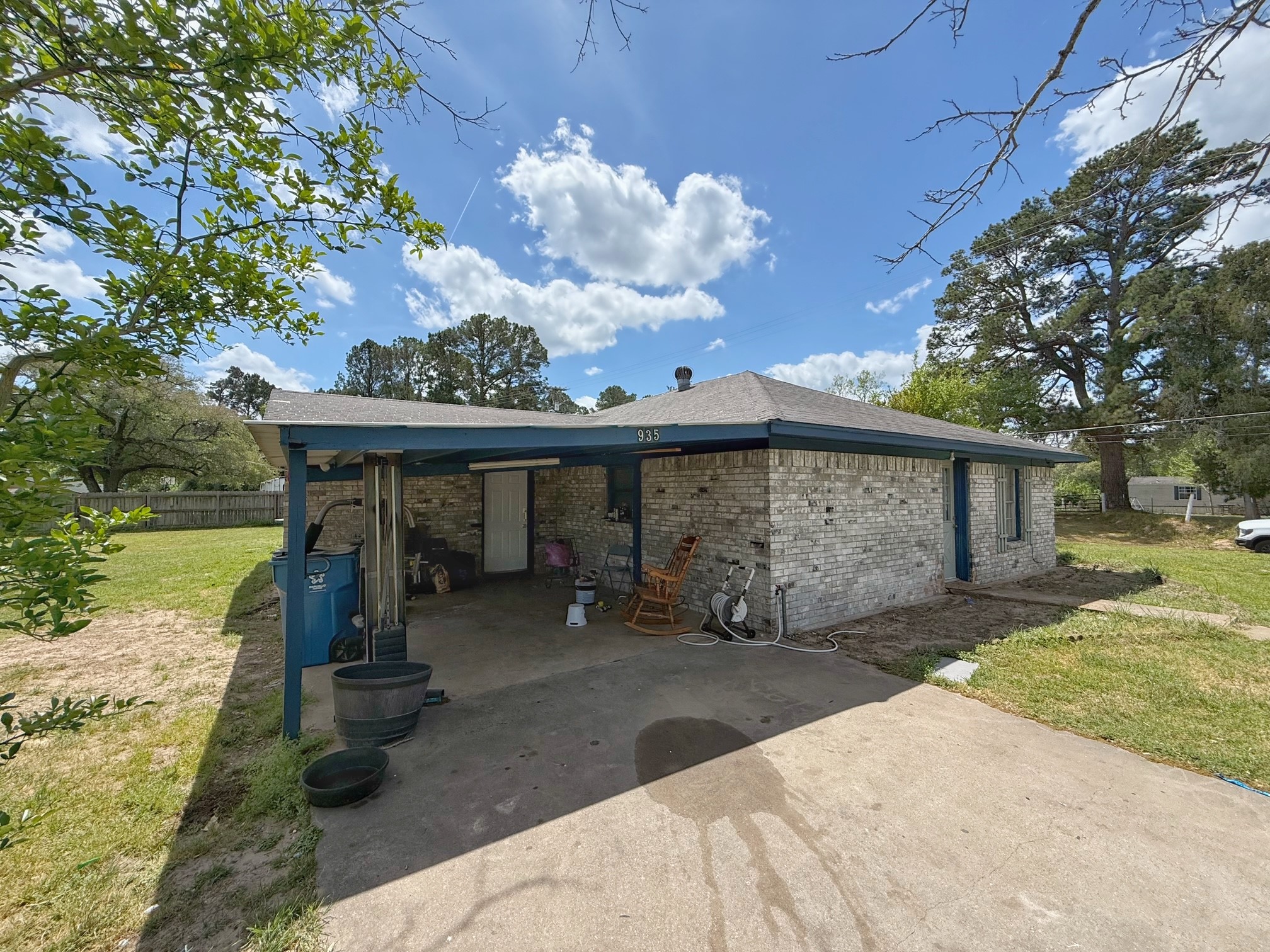 935 Center Street Buffalo, TX 75831 - Photo 5 of 18 a view of a house with a backyard and a tree