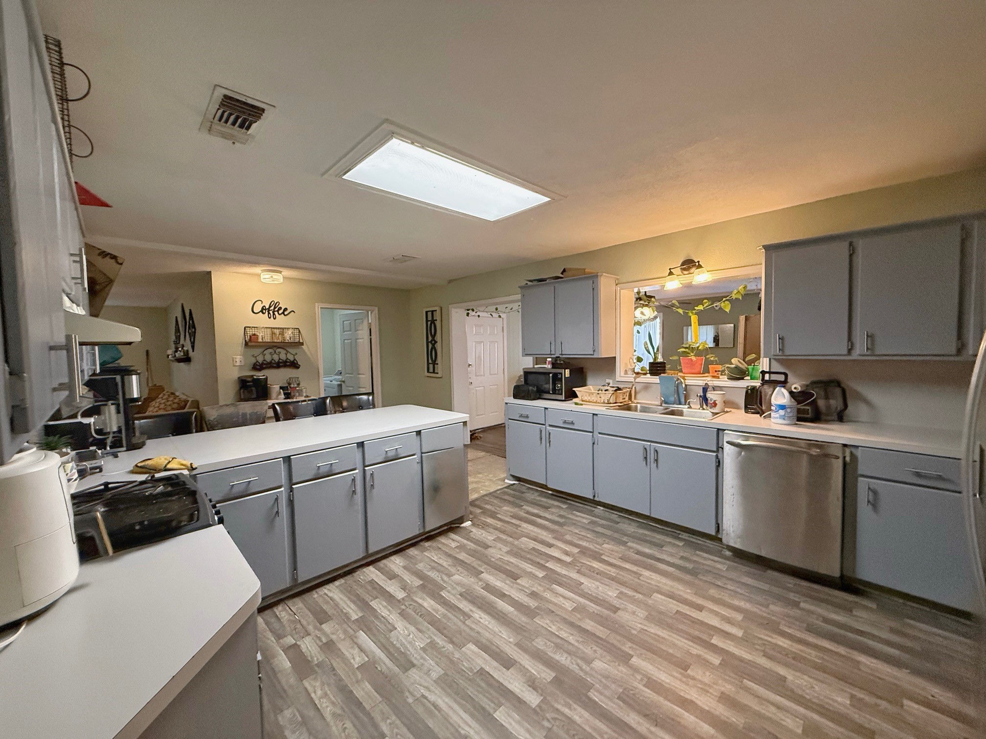 935 Center Street Buffalo, TX 75831 - Photo 7 of 18 a kitchen filled with white cabinets and white appliances