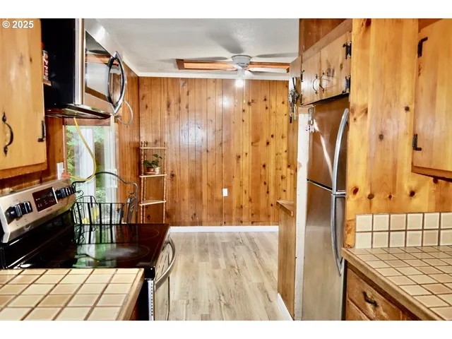 a view of a work space with furniture and wooden floor