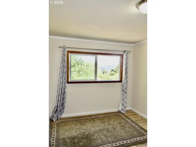 a view of a room that has a window in it