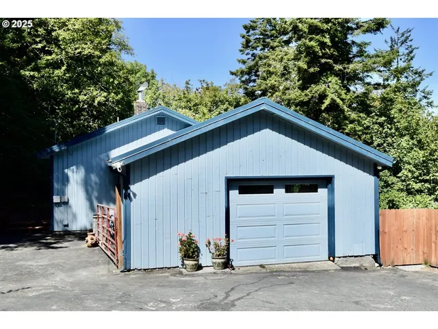 a view of a house with a backyard space