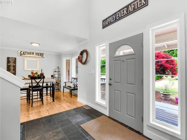 a view of a dining area with furniture and a potted plant