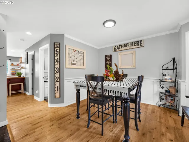 a dining room with furniture and window