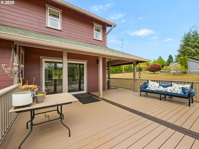 a balcony with furniture and a potted plant