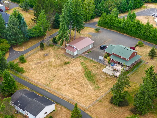 an aerial view of residential house with outdoor space