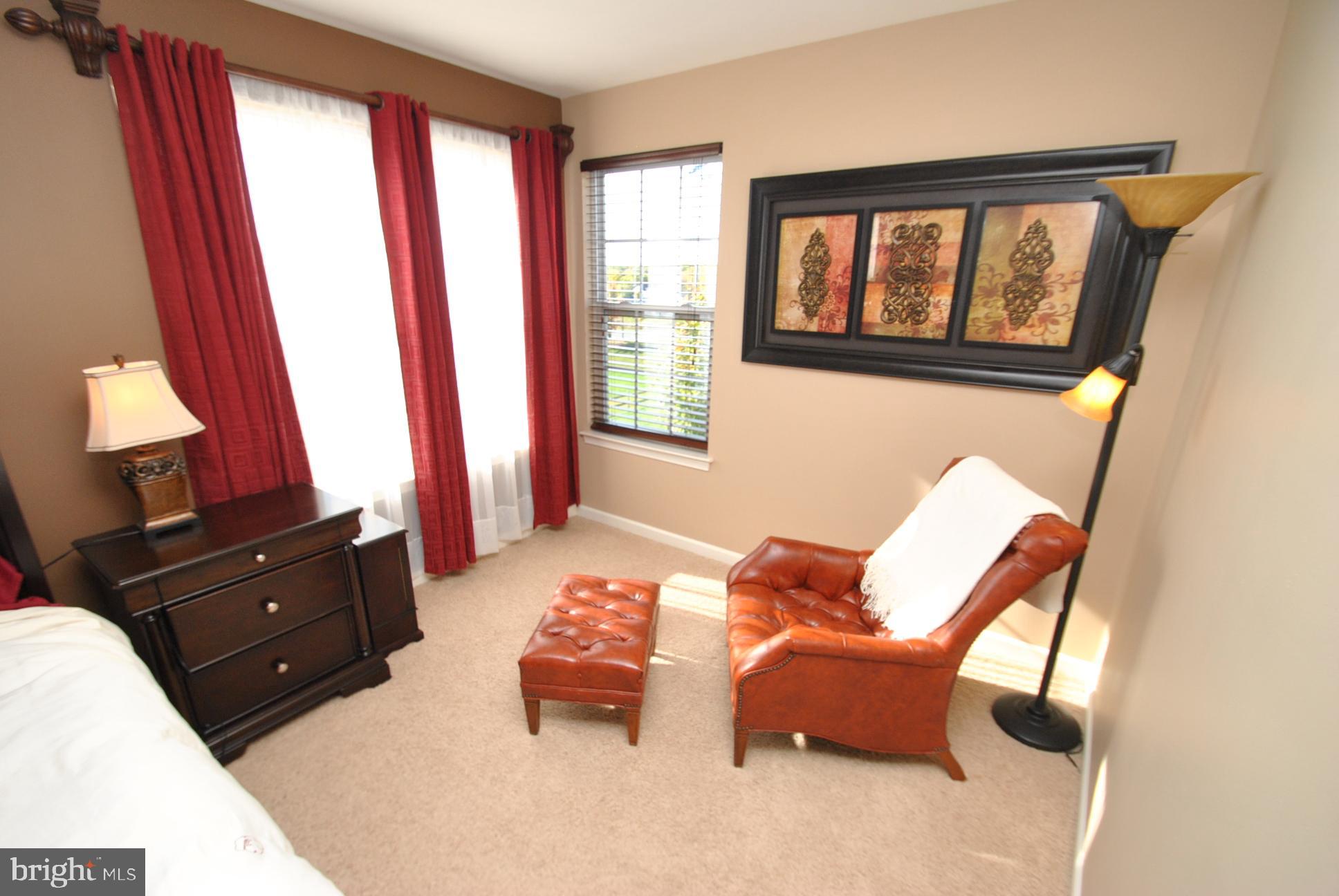 5111 Honeybrook Way Perry Hall, MD 21128 - Photo 12 of 20 a bedroom with a bed and wooden floor