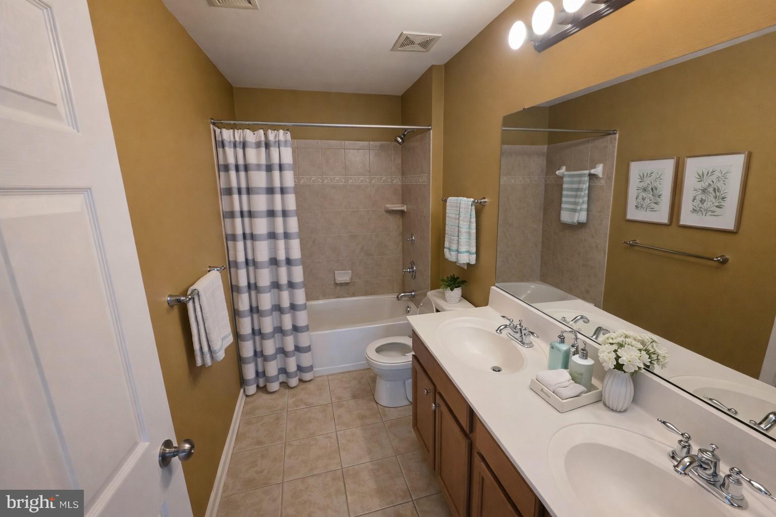 5111 Honeybrook Way Perry Hall, MD 21128 - Photo 18 of 20 a bathroom with a sink a toilet and shower