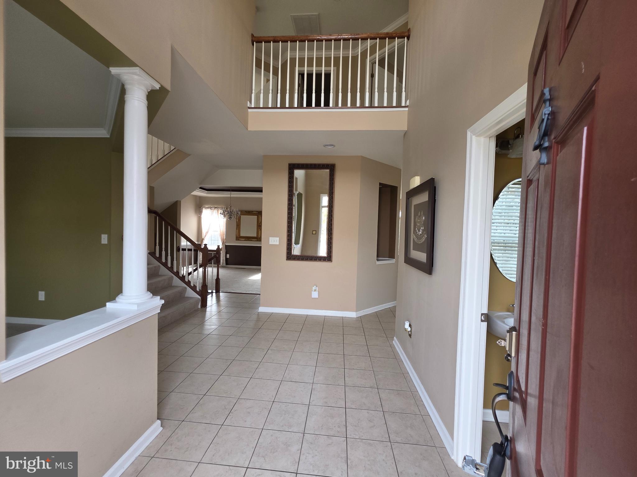 5111 Honeybrook Way Perry Hall, MD 21128 - Photo 4 of 20 a view of a hallway with couches and a livingroom with furniture