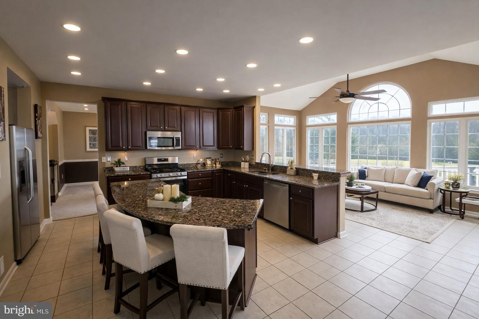 5111 Honeybrook Way Perry Hall, MD 21128 - Photo 8 of 20 a large kitchen with kitchen island granite countertop a living room and a large window