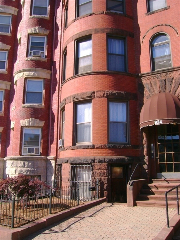 924 Beacon Street, Unit 6 Boston, MA 02215 - Photo 20 of 28 a front view of a building with many windows