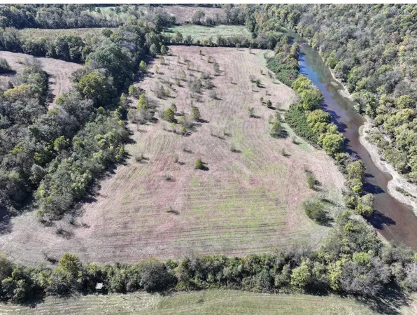 an aerial view of house with yard