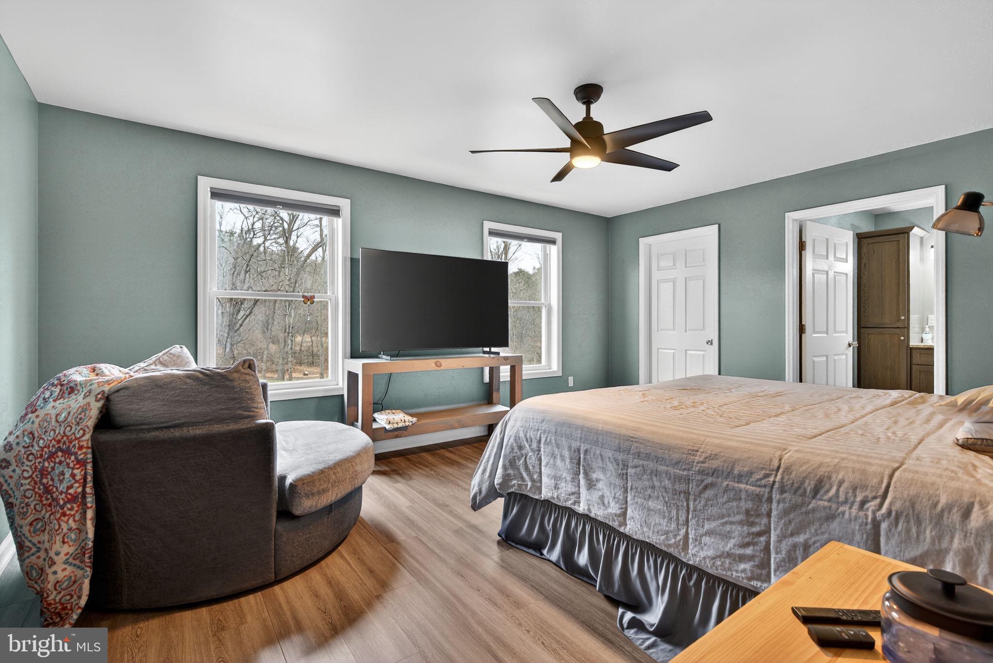 849 Sugar Run Road Millerstown, PA 17062 - Photo 13 of 34 a bedroom with a bed and a flat screen tv