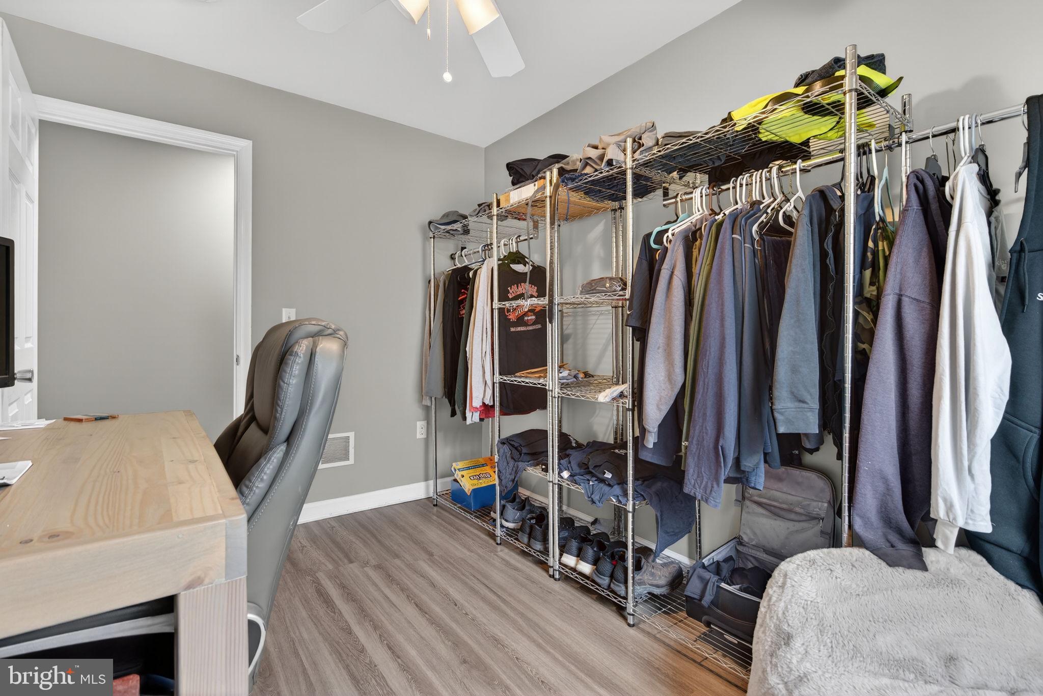 849 Sugar Run Road Millerstown, PA 17062 - Photo 18 of 34 a view of walk in closet with clothes and shoes
