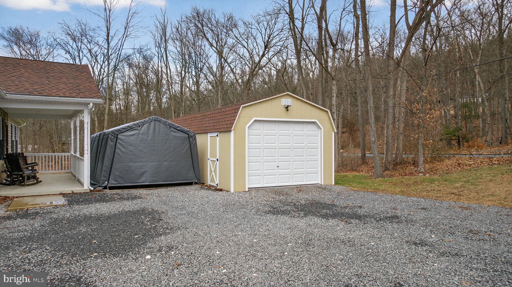 849 Sugar Run Road Millerstown, PA 17062 - Photo 2 of 34 a view of a house with a yard and garage