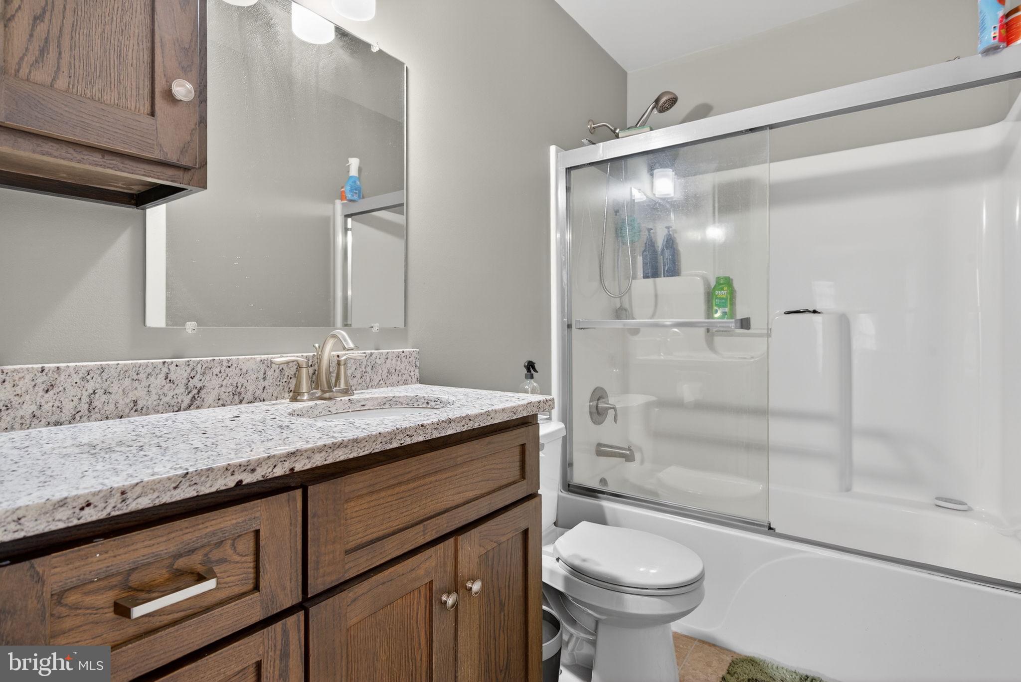849 Sugar Run Road Millerstown, PA 17062 - Photo 21 of 34 a bathroom with a granite countertop sink toilet and shower