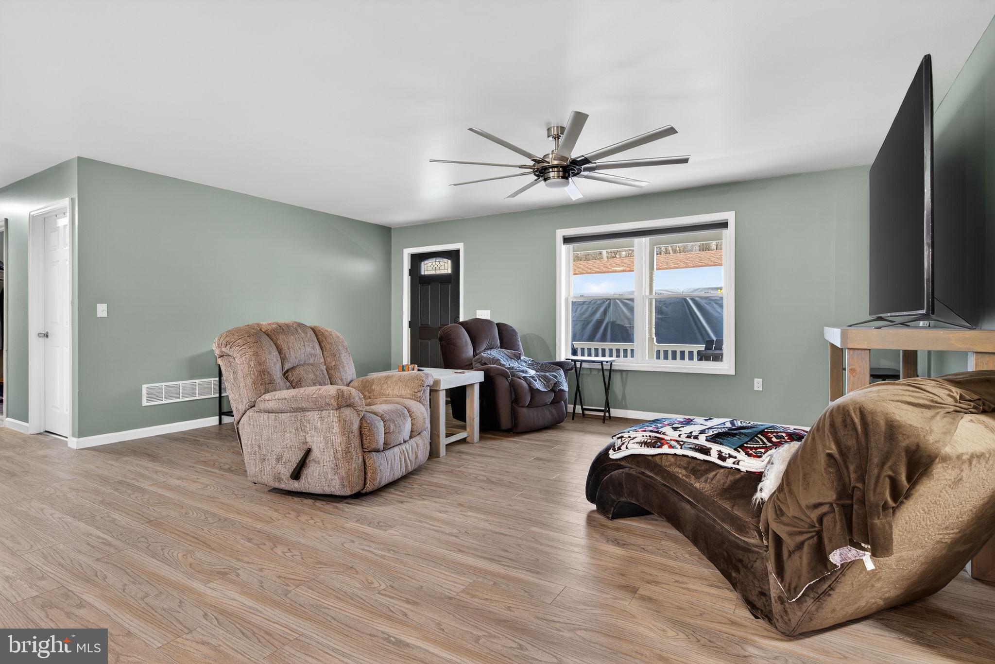 849 Sugar Run Road Millerstown, PA 17062 - Photo 5 of 34 a living room with furniture and a window