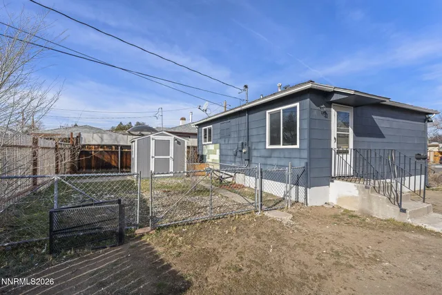 a front view of a house with parking space