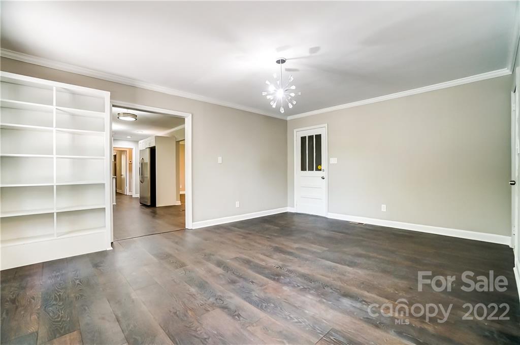 502 Plantation Road Lancaster, SC 29720 - Photo 16 of 44 wooden floor in an empty room with a window