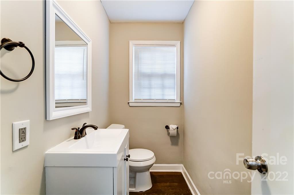 502 Plantation Road Lancaster, SC 29720 - Photo 19 of 44 a bathroom with a toilet sink and mirror