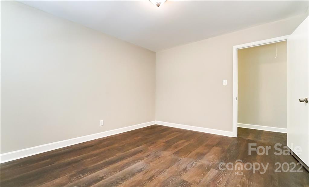 502 Plantation Road Lancaster, SC 29720 - Photo 28 of 44 a view of an empty room with wooden floor