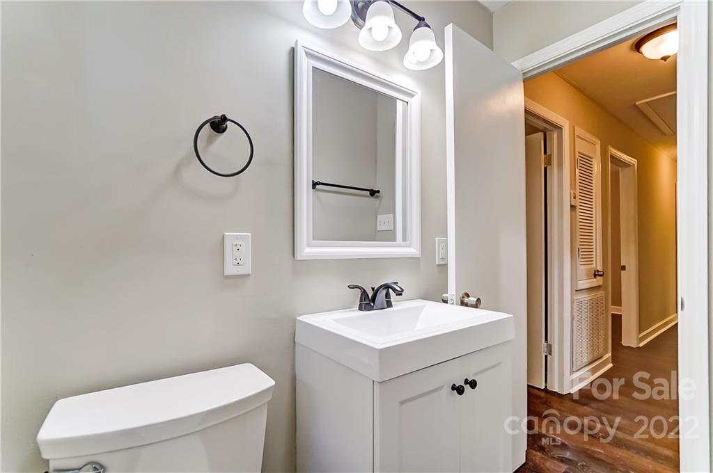502 Plantation Road Lancaster, SC 29720 - Photo 31 of 44 a bathroom with a toilet sink and mirror