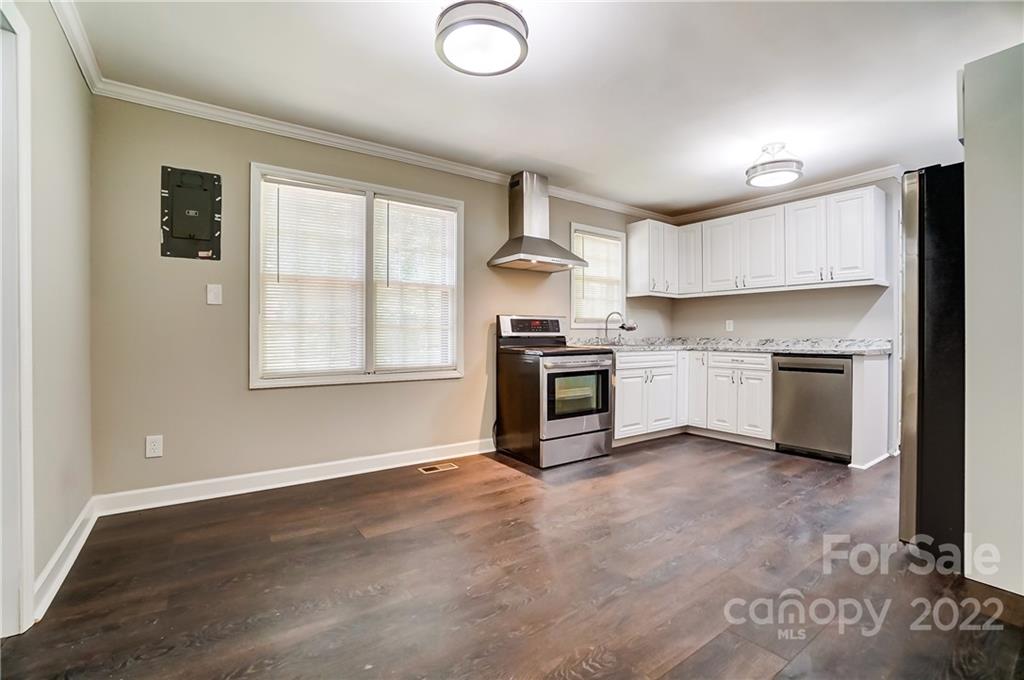 502 Plantation Road Lancaster, SC 29720 - Photo 8 of 44 a kitchen with stainless steel appliances granite countertop a stove a sink and a refrigerator