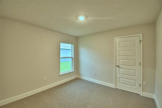 an empty room with walk in closet