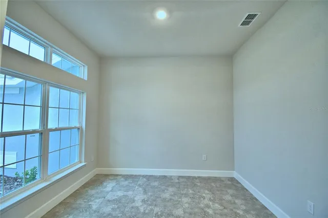 a view of an empty room with a cabinet