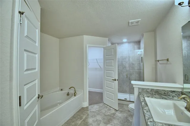 a bathroom with a shower and toilet