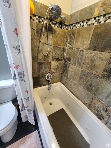 2525 West 450 South, Unit 8 Springville, UT 84663 - Photo 10 of 22 Bathtub with integrated jets and a wall-mounted showerhead